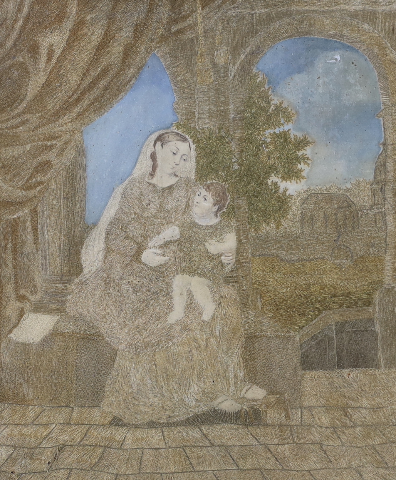 Two framed Regency silk and wool-worked religious panels, one of Mary and baby Jesus and the other of a lady in a garden by a pillar, largest 27cm wide x 31cm high